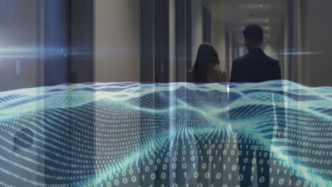 senior manager and junior associate walking down corridor, showing tech binary code overlay