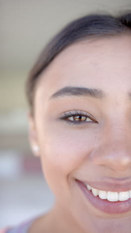 vertical video: smiling woman close-up, showing happiness and positive emotions at home