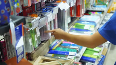 vinnitsa, ukraine - august 20, 2018: child choosing school stationery in store