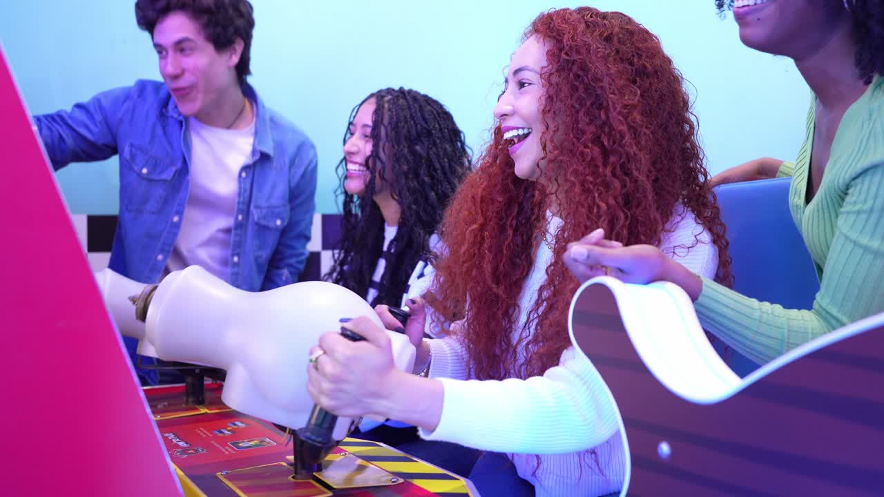 Friends Having Fun Playing Arcade Games