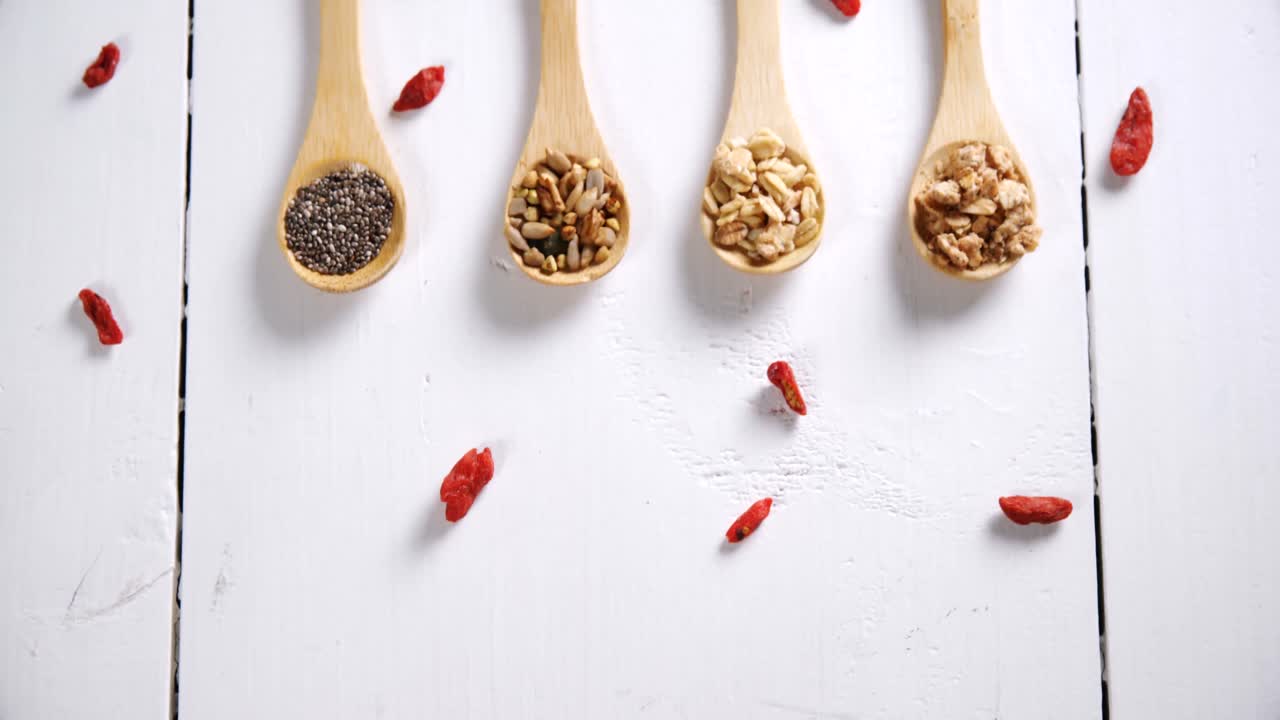Various oatmeal in wooden spoon 4k