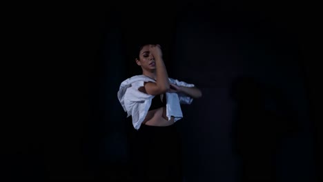 young latina woman dancing whacking in gorgeous sensual confident eye contact