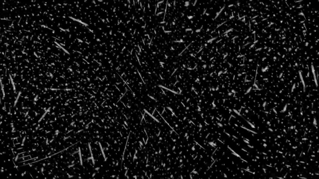 Heavy Snow and Particles Falling on Black Background