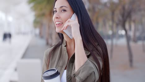 happy young woman chatting on her mobile