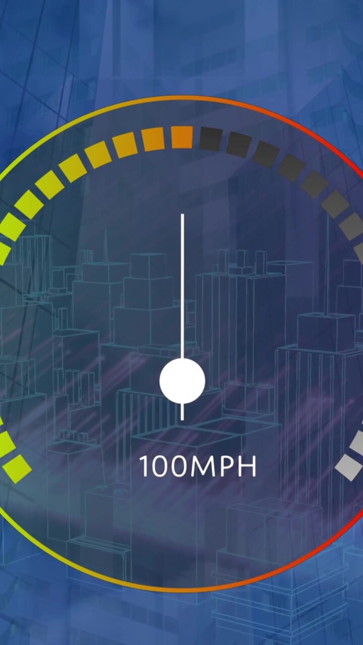 Animation of speedometer and light trails over 3d city model spinning against tall buildings