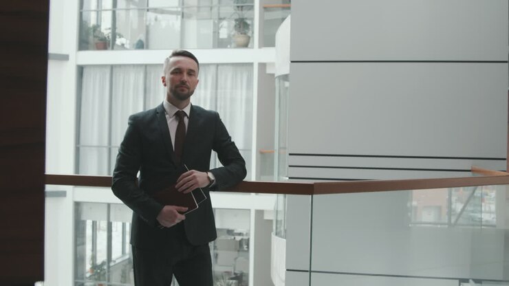 Portrait of Young Business Man in Modern Office