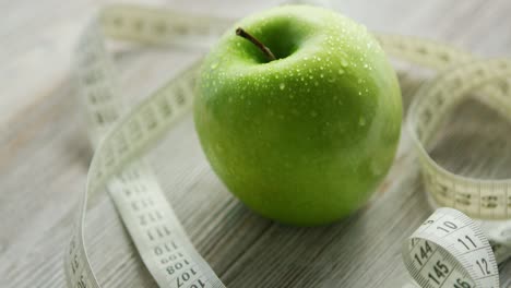 green apple and tape measure