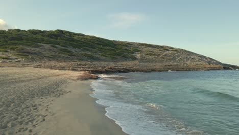 experience the serene beauty of cala torta and cala mesquida in mallorca. soft waves lap against sandy shores under a sunny sky, perfect for relaxation and exploration.