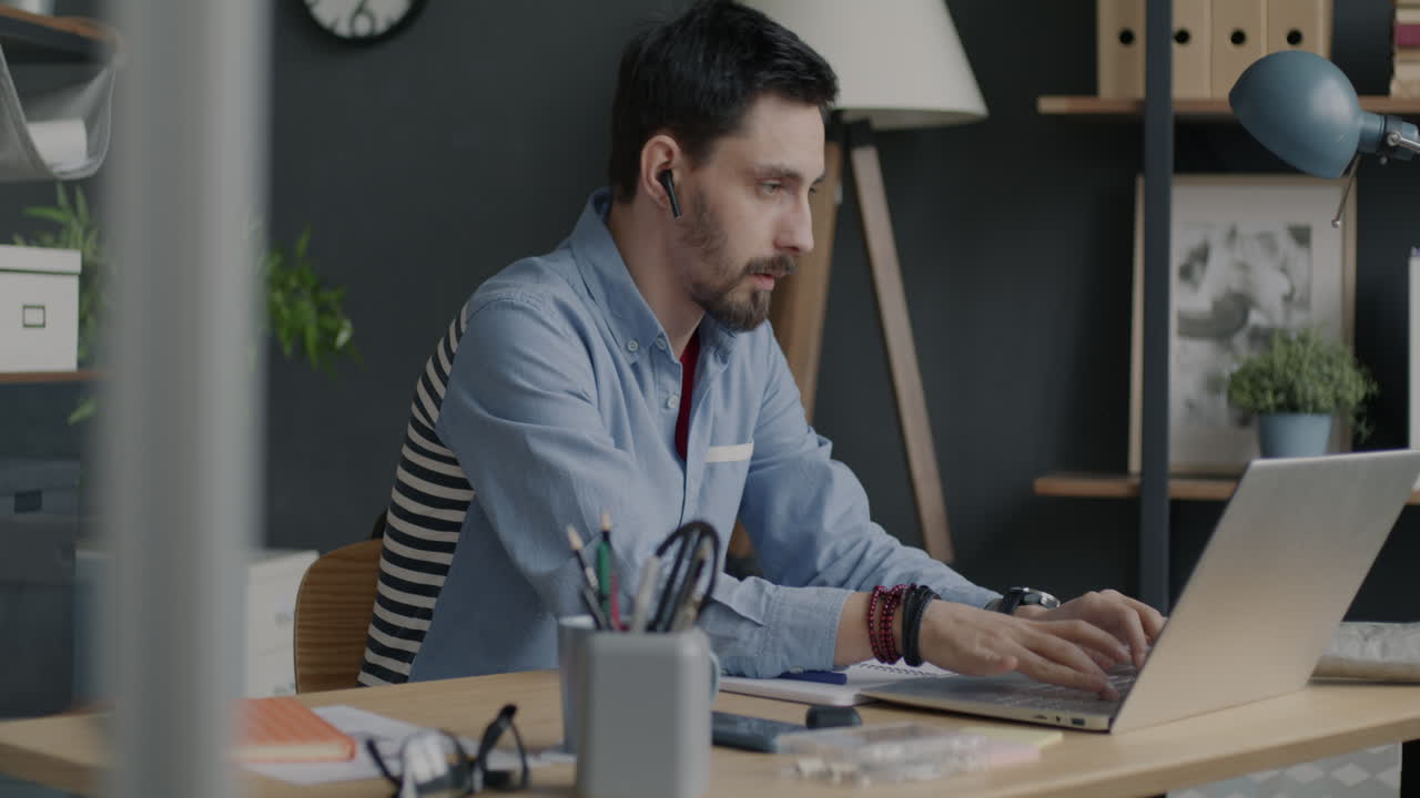 Man Working from Home on Laptop