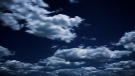 a serene transition of darkening skies with floating clouds pulsating softly against the twilight backdrop, evoking calmness and mystery in nature's majesty