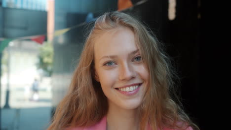 young woman smiling outdoors