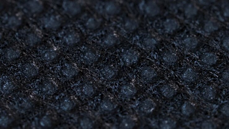 Black textile cloth surface texture, macro shot close up view with rotation motion