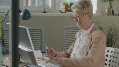 Senior Businesswoman Working on Computer