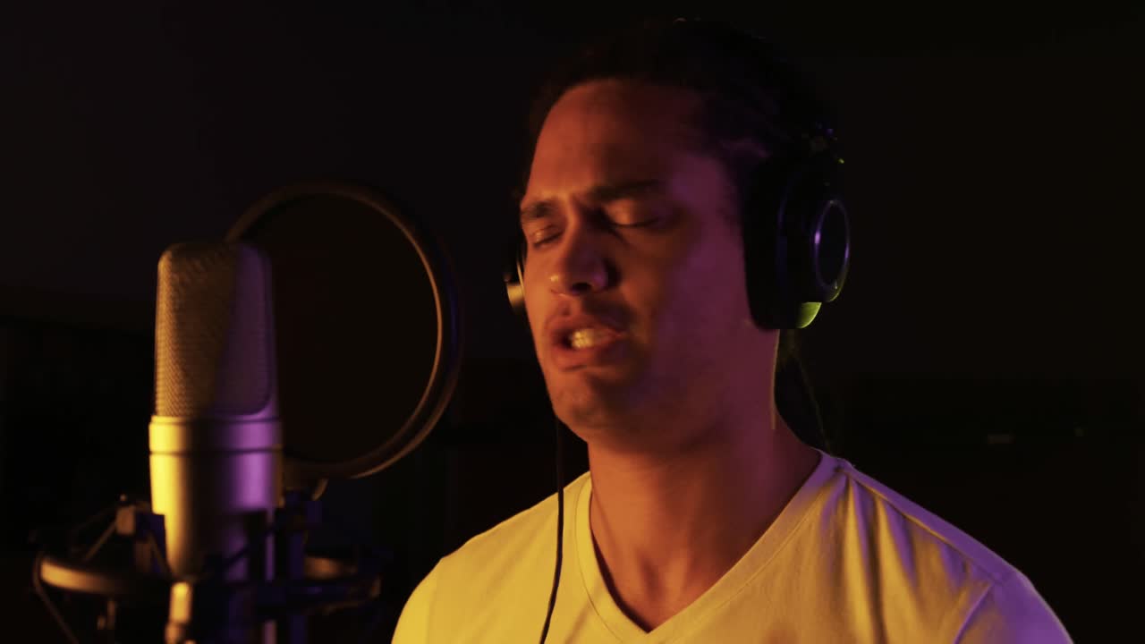 Male singer singing in a music studio