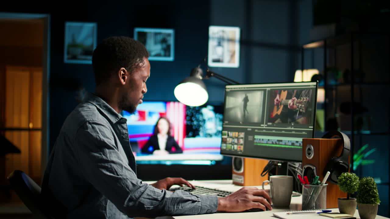 Young filmmaker working on media post production from agency office