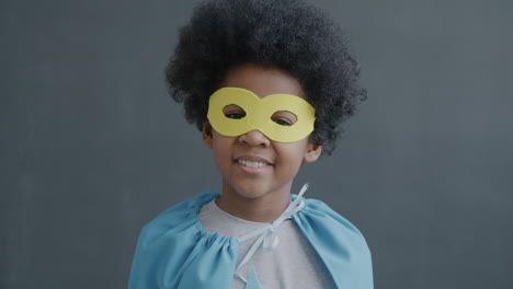 child dressed as superhero