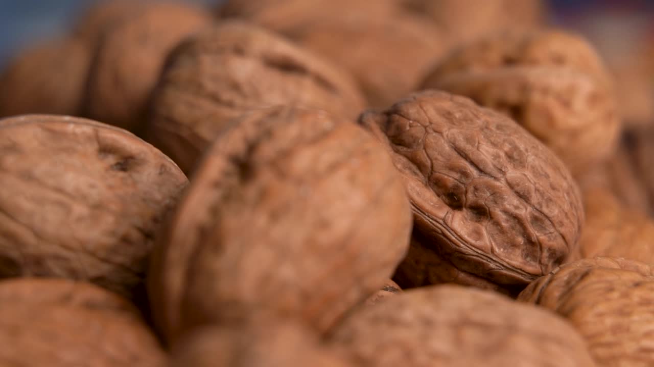 Close up view of macro shot walnuts with shell on the table