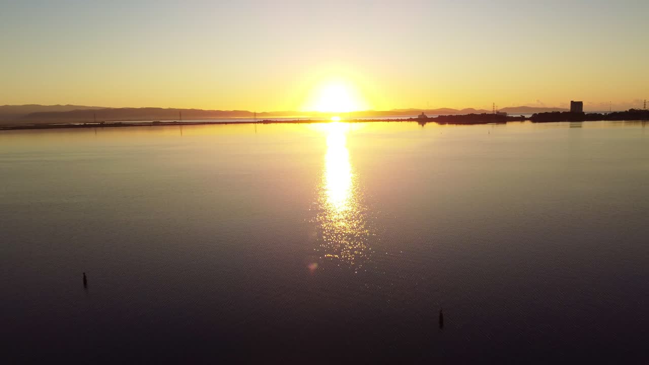 Sensational aerial view of sunrise in Sant'Antioco lagoon, calm clear water
