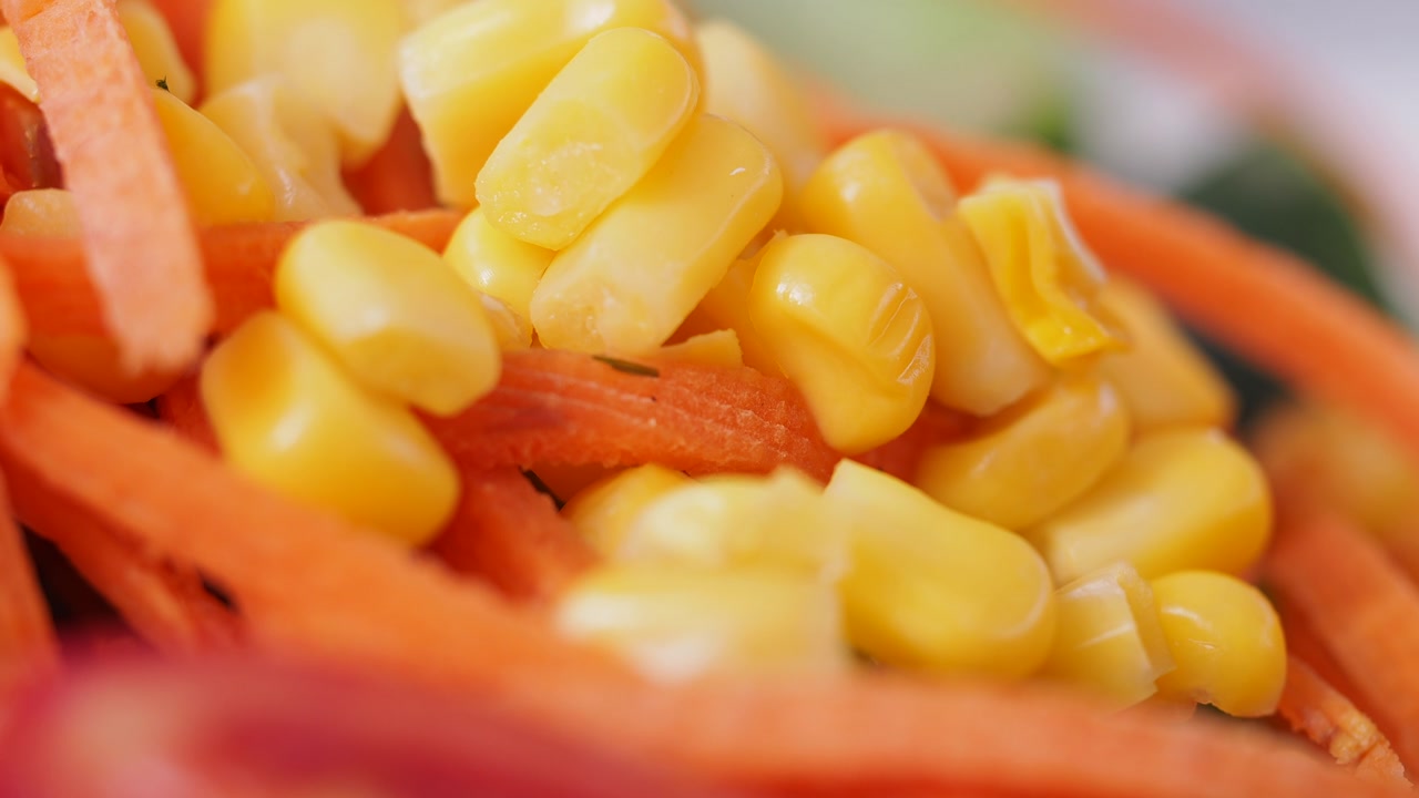 Close-up of Fresh Corn Kernels and Shredded Carrots