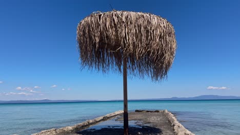 Stunning beach scene in Halkidiki, Greece, with elegant sunbeds facing the crystal-clear turquoise sea. A perfect summer escape in the heart of the Aegean.