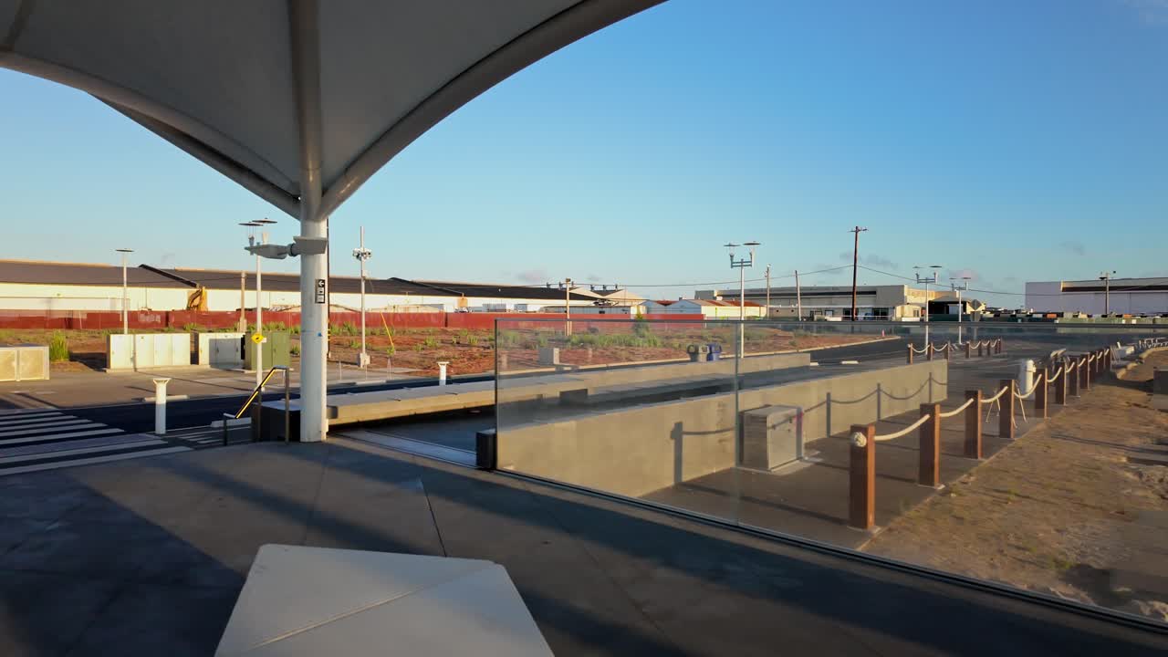 Slow motion waterfront view showing the Seaplane Lagoon Ferry Terminal and its ferry docking infrastructure