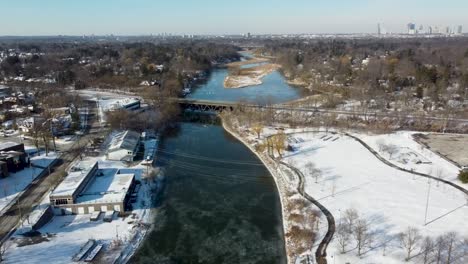 flying up a frozen winter river in mississauga