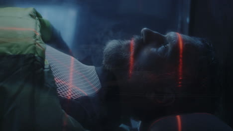 a man undergoing a futuristic medical scan