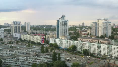 aerial view of a city with modern and residential buildings under a cloudy sky