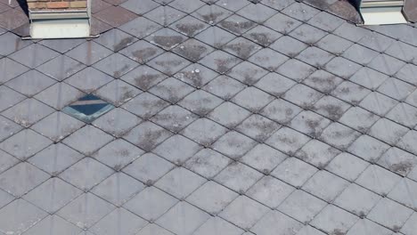 old roof covered made of eternit tile in a residential building