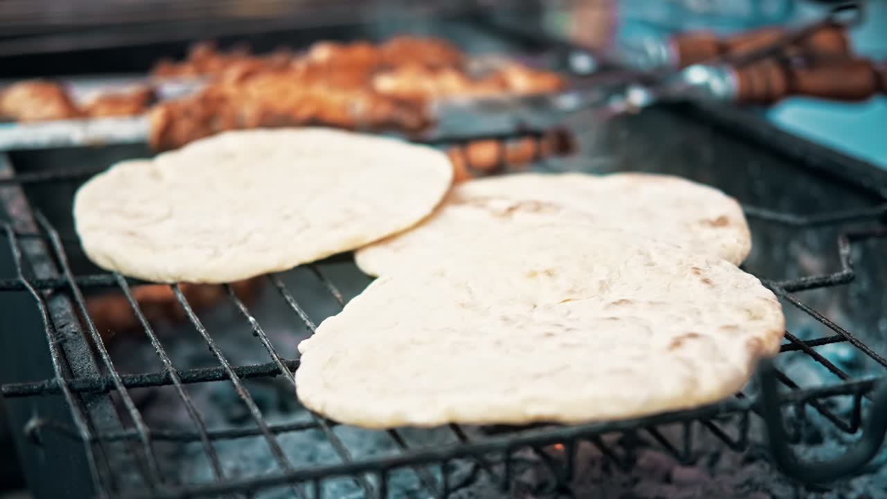 Flatbreads frying on a grill at food festival