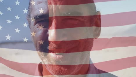Animation-of-flag-of-american-waving-over-closeup-of-smiling-caucasian-mature-man-against-sky