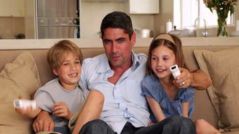 Cute-children-playing-video-games-with-their-father