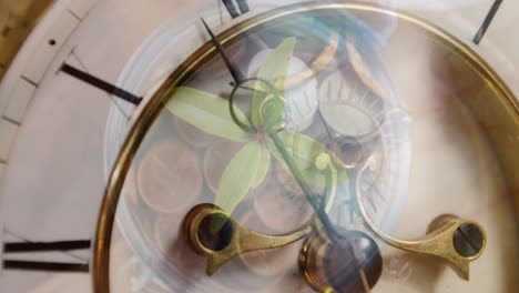 digital composite video of close up of ticking clock against jar full of coins