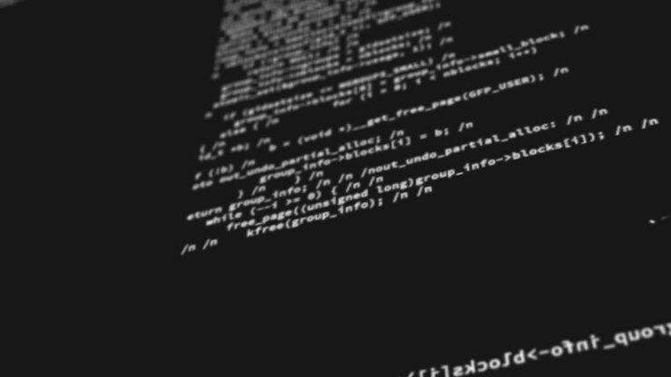 Computer codes projected on the screen while being written or typed
