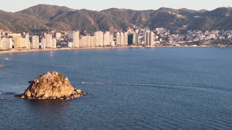 lateral drone shot of acapulco bay