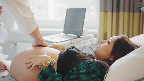 pregnant woman undergoing ultrasound examination
