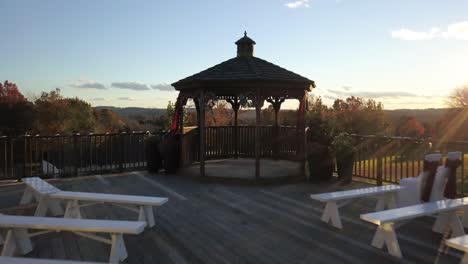 flying over romantic gazebo and revealing majestic landscape