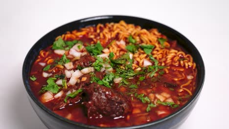 birria ramen rotating on a lazy susan