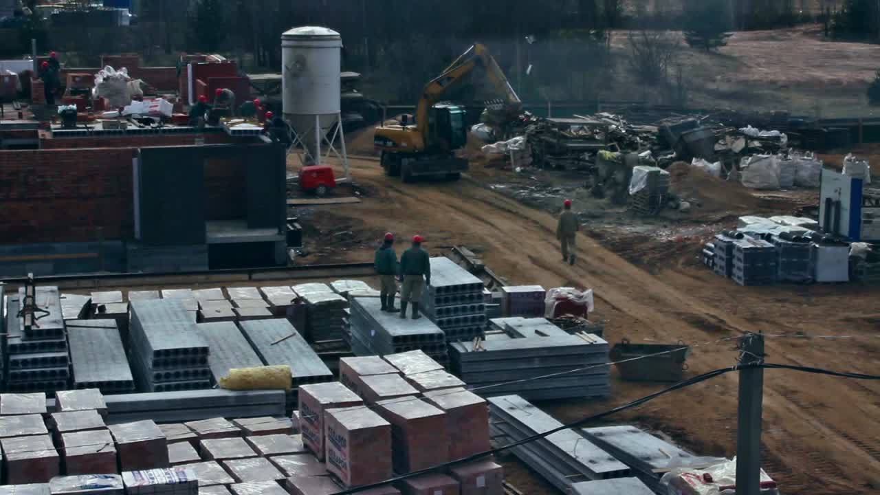 The crane raises and lowers the deck block on the building's construction. Time Lapse