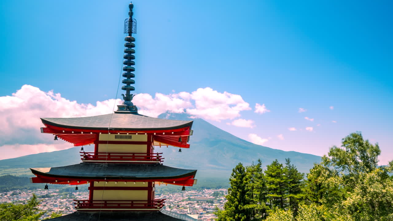 Chureito pagoda and Fuji mount Japan zoom in moving timelapse clouds blue sky