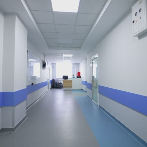 hospital corridor with rooms. long empty corridor of large clinic