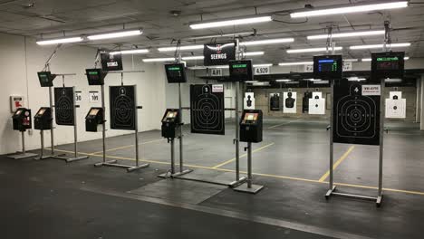overview of a shooting range with electronic target systems and scoring monitors for precision training in a controlled environment