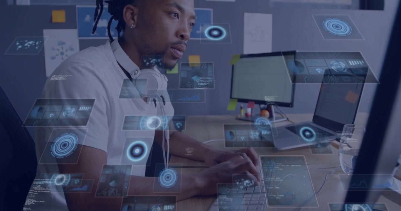 Male dev typing at desk, initiating holographic panels multiplying across monitor for analysis