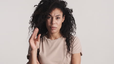 african american serious woman over white background.