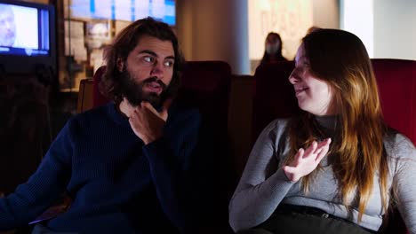 couple discussing at a museum exhibition