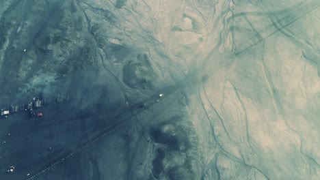 jeeps moving below think mist in mount bromo an aerial view, indonesia