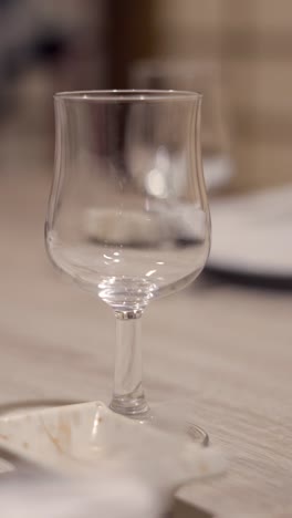 an empty stemmed glass on a table