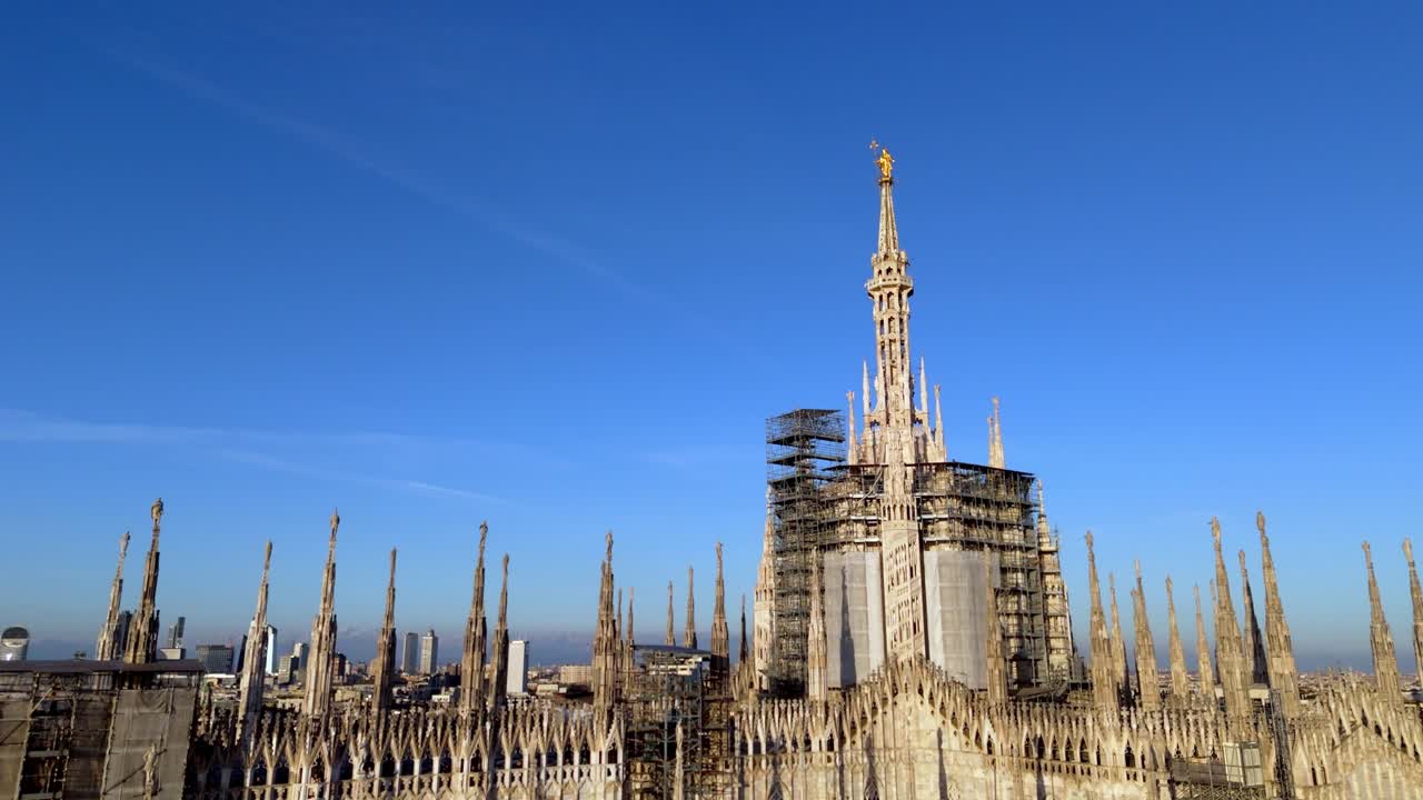 low angle aerial close up drone view of Milan duomo cathedral revealing the cityscape