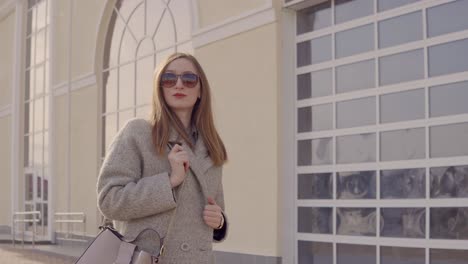 stylish woman in a grey coat