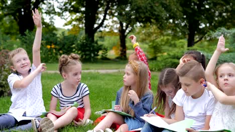 group of cheerful children learning outdoors at school after quarantine lockdown